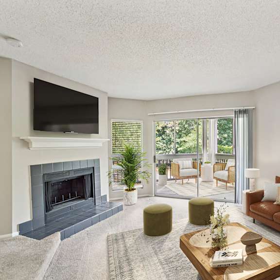 a living room with a fireplace and a flat screen tv at beacon ridge apartments, prg real estate management, greenville, 29615