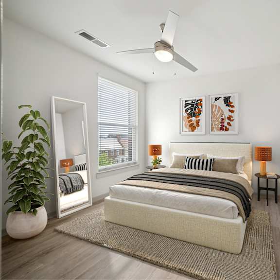 a bedroom with a bed, a ceiling fan, and a potted plant at circ apartments, virginia