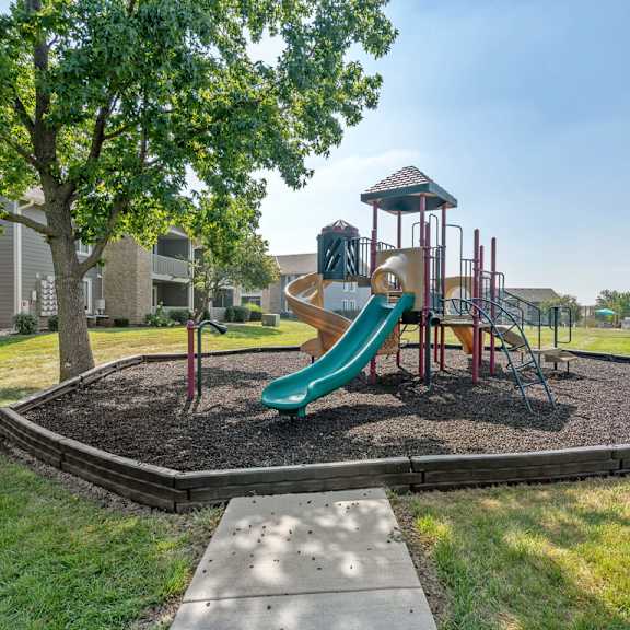 playground with slide at the reserve at barry apartments, kansas city, missouri