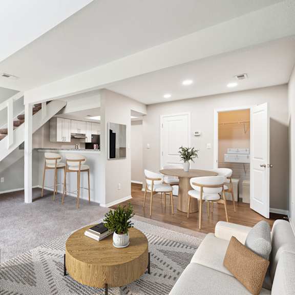 a living room with a staircase and a dining area at woodcreek apartments, cary, 27511