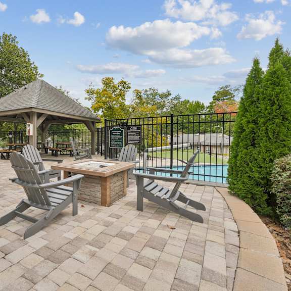 outdoor fire pit seating area at park ridge estates apartments