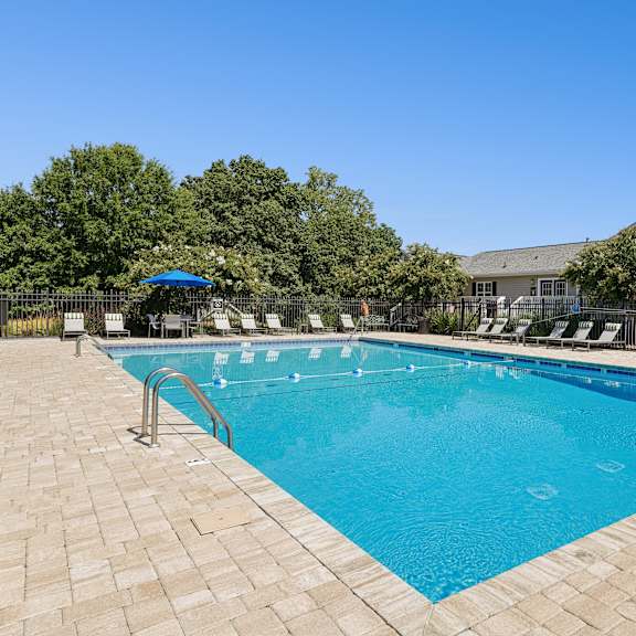 sparkling swimming pool and sundeck at hyde park apartment & townhomes chester, va 23831