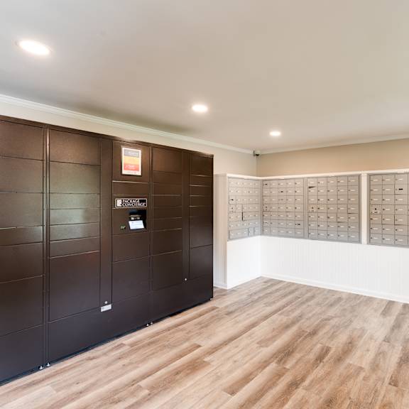 a lockers room with wooden floors and white walls at woodcreek apartments, cary, north carolina 27511