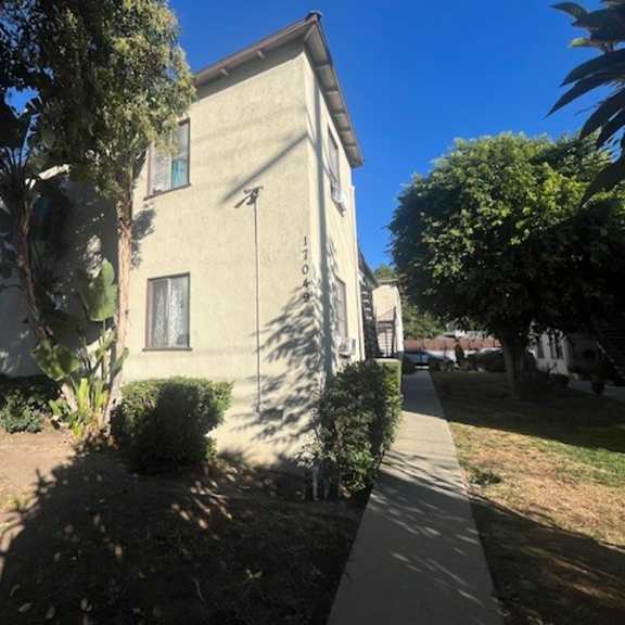 a house with a tree in front of it.