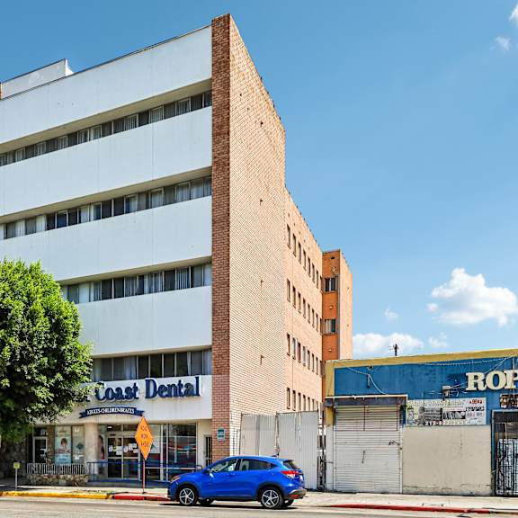 a multi-story building with a dental office on the ground floor.