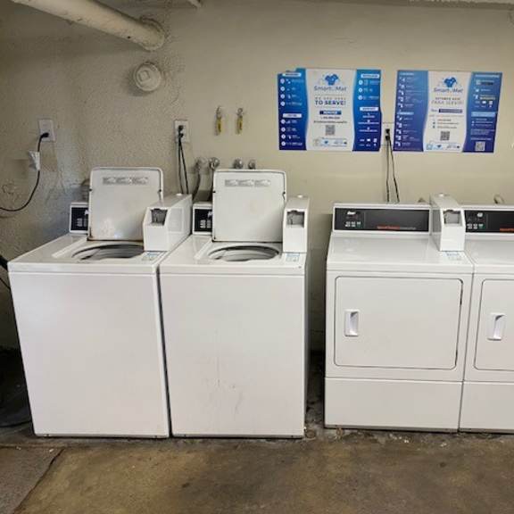 a row of washing machines in a laundromat.