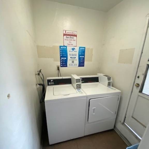 a small laundry room with a washer and dryer.