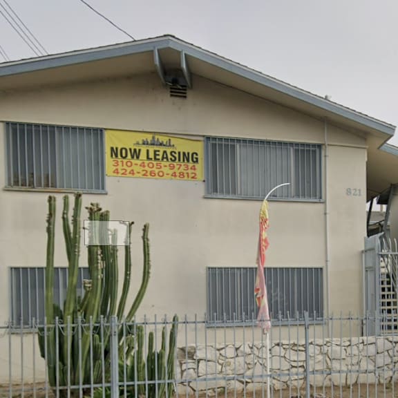 a house with a sign that says "now leasing".