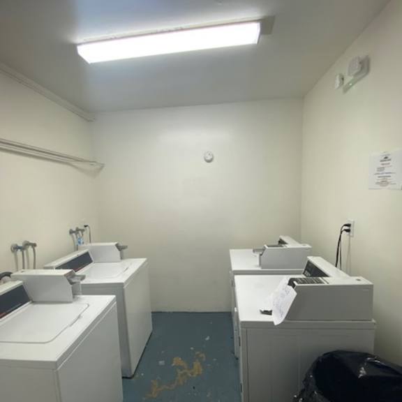 a bathroom with two sinks and a toilet.