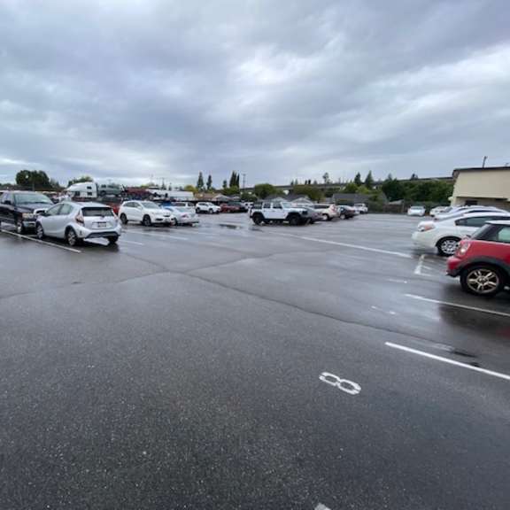 a parking lot with cars parked in it.