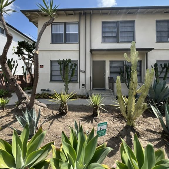 a house with a garden in front of it.