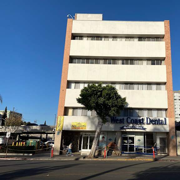 a building with a dental office on the ground floor.