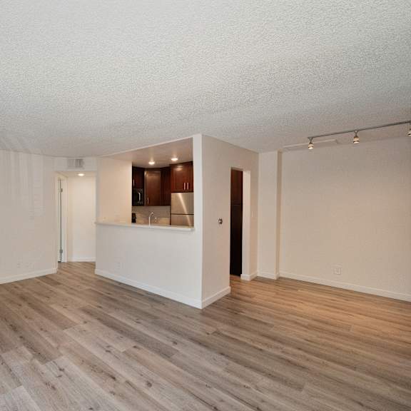 a living room with a fireplace and hardwood floors at croft plaza apartments, west hollywood, 90069