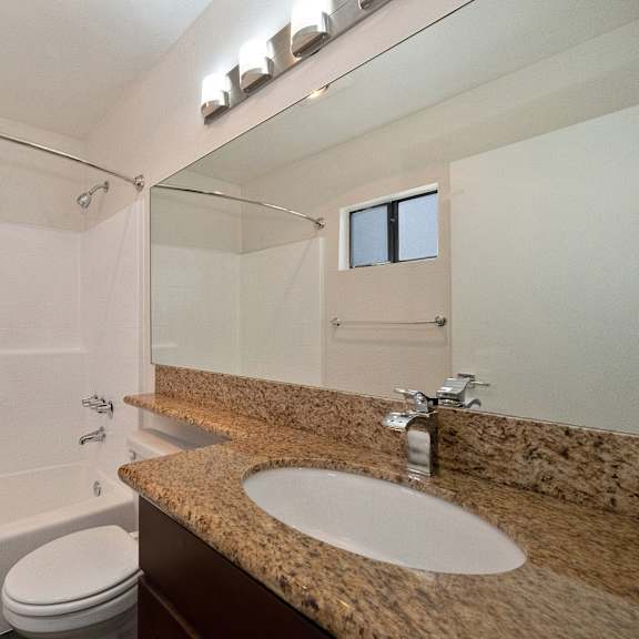 a bathroom with a bathtub and a sink at croft plaza apartments, west hollywood
