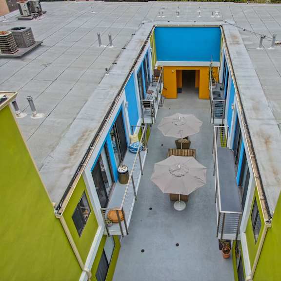 drone photo of above the community common area in the middle of the complex at croft plaza apartments, west hollywood.
