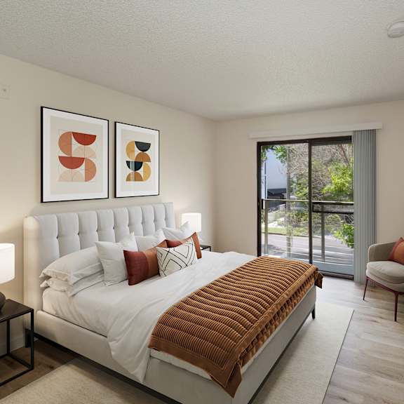 a bedroom with a bed and a desk with a chair at croft plaza apartments, west hollywood, ca