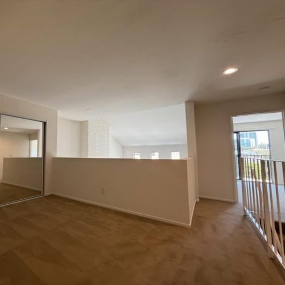 Thumbnail 5 of 20 Empty room with a sliding door and a window.
