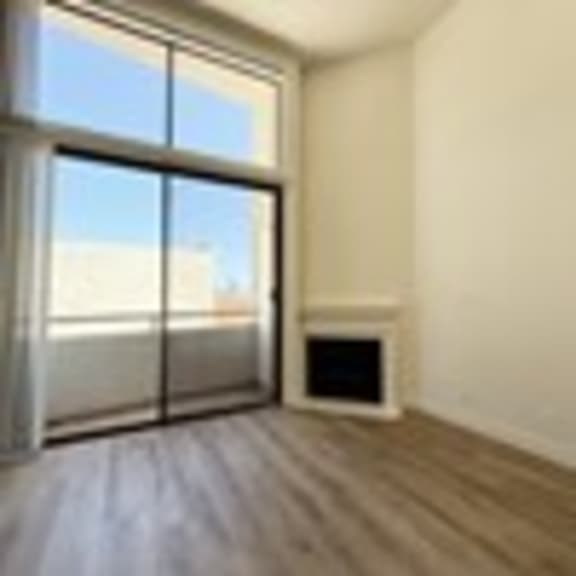 Thumbnail 39 of 53 A room with a window and a radiator on the floor.