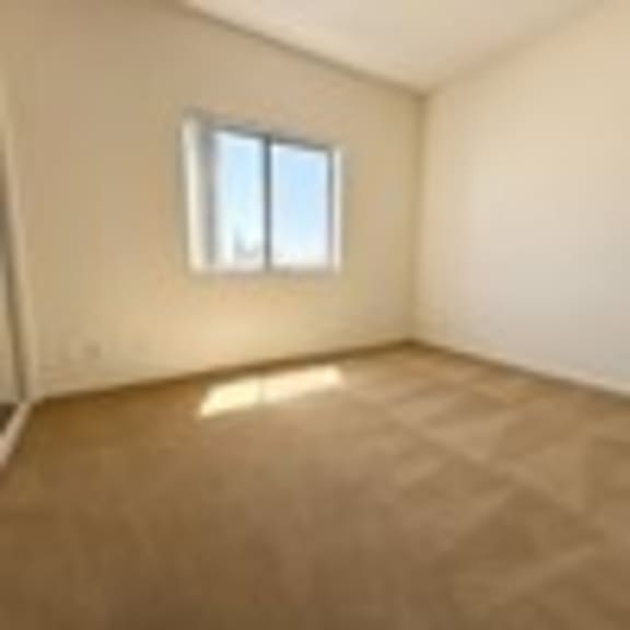 Thumbnail 45 of 53 A room with a window and a white wall.