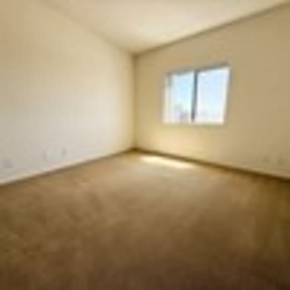 Thumbnail 42 of 53 A room with a window and no furniture.