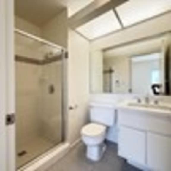 Thumbnail 47 of 53 A white toilet sits in a bathroom next to a sink.