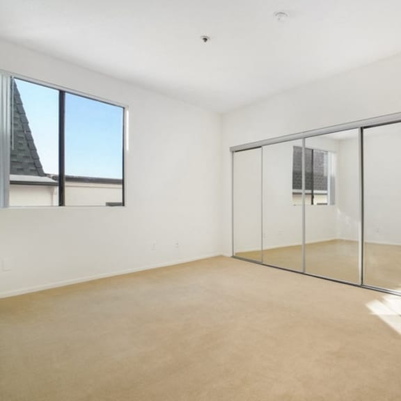 Thumbnail 12 of 17 A room with a glass door and a window.