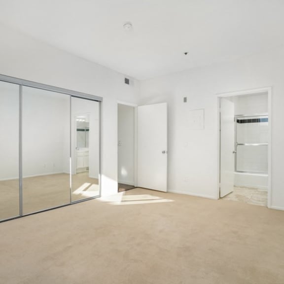 Thumbnail 14 of 17 A room with a glass door and a white door.