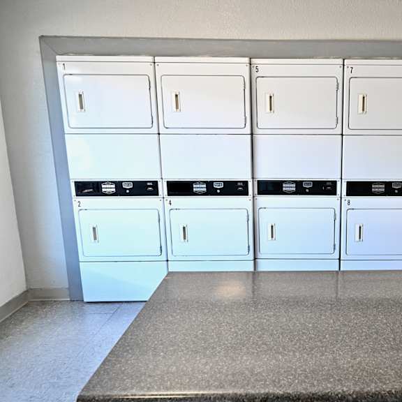 a row of white lockers in a room.