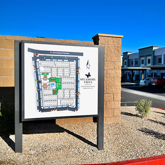 a map of the sycamore village complex is displayed on a sign.