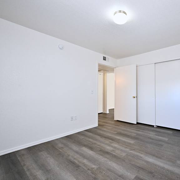 a room with a white door and a white wall.