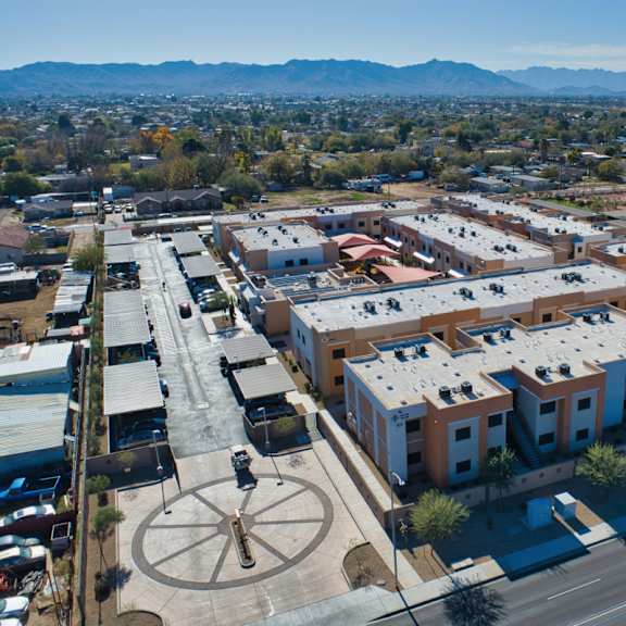 avalon village is a large, well-organized community with a central fountain and a variety of buildings.