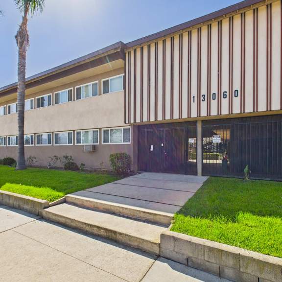 a modern building with a brown and white striped facade.