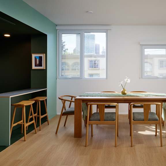a dining room with a wooden table and chairs.