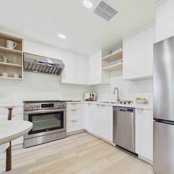 a modern kitchen with a stainless steel refrigerator.