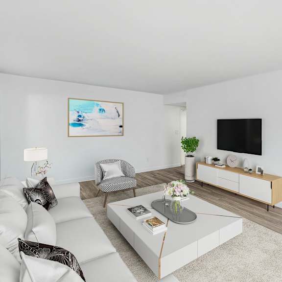 a living room with a white couch and a coffee table