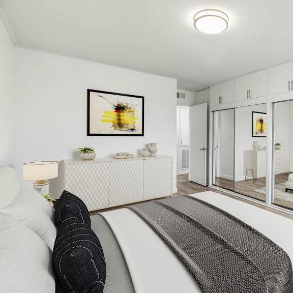 a bedroom with a bed and a mirror