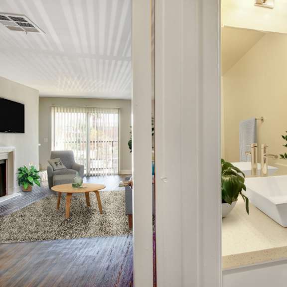 a bathroom with a white sink and a mirror.