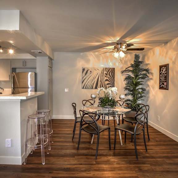 a dining room with a table set for six people.