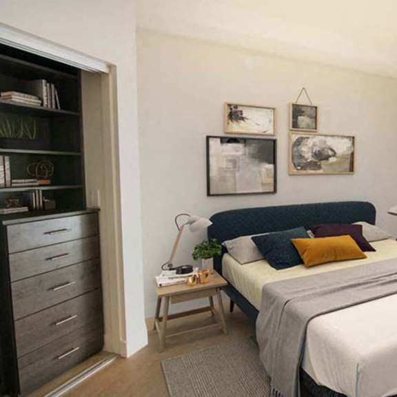 Thumbnail 3 of 7 a bedroom with a bed and some pictures on the wall at Wilshire Margot, California
