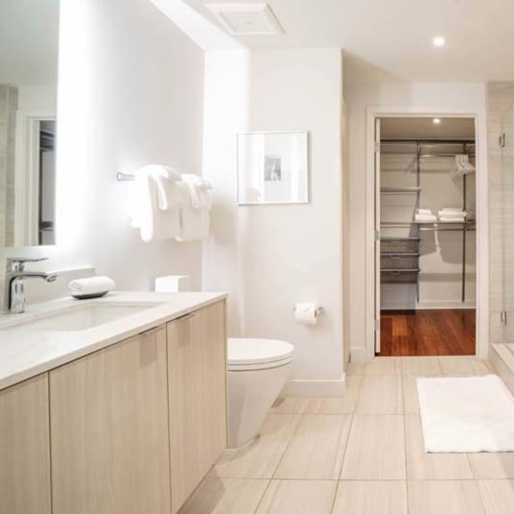 Thumbnail 4 of 7 a bathroom with a toilet a sink and a shower
