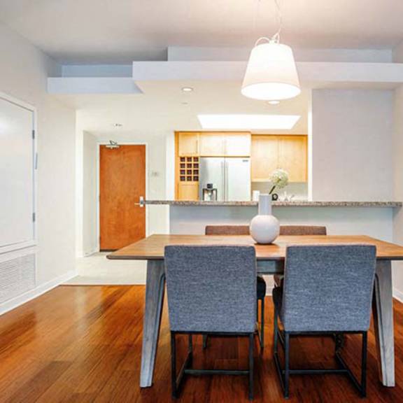 Thumbnail 4 of 6 a dining room with a table and chairs at Wilshire Margot, Los Angeles, 90024