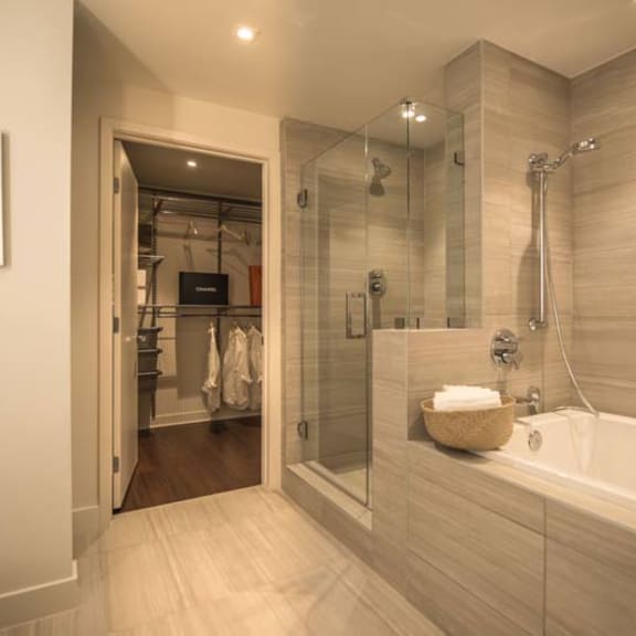 Thumbnail 5 of 8 a bathroom with a tub and a shower and a toilet