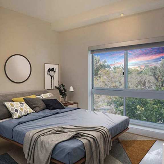 Thumbnail 5 of 7 a bedroom with a bed and a large window at Wilshire Margot, Los Angeles California