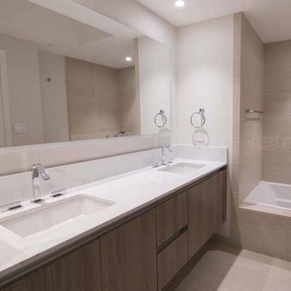 Thumbnail 7 of 7 a bathroom with two sinks and a bath tub at Wilshire Margot, California, 90024