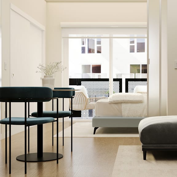 a modern bedroom with a large bed and a round table.