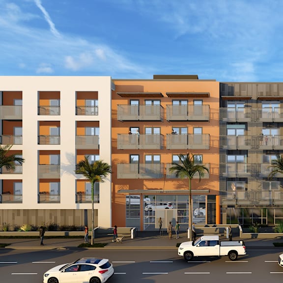 a modern building with a parking lot in front of it.