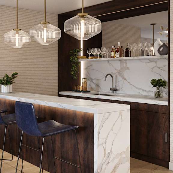 a modern bar area with a marble counter and blue bar stools.