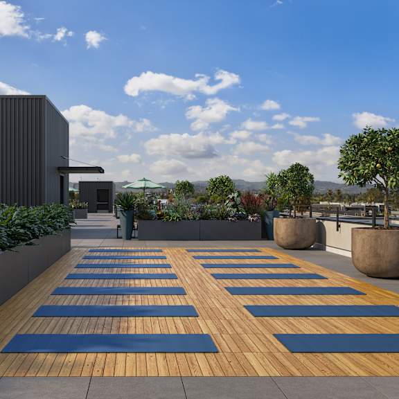 a modern outdoor area with wooden and blue mats.