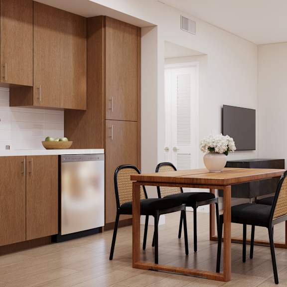 a modern dining room with a wooden table and chairs.