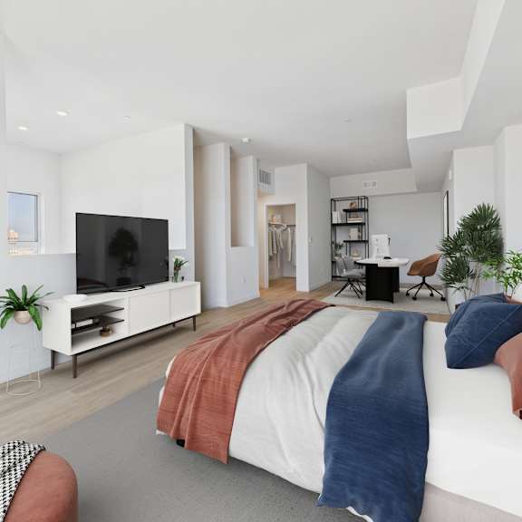 a modern bedroom with a large bed and a television.
